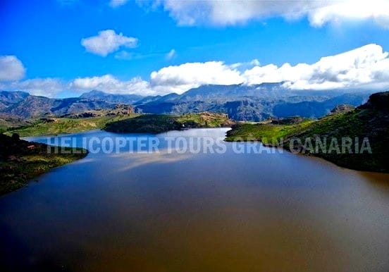 Helicopter over Gran Canaria lakes and mountains