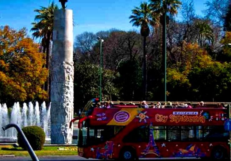 Ride the open-top sightseeing bus in Seville