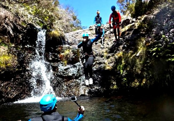 Canyoning in Madeira jumping into water ponds