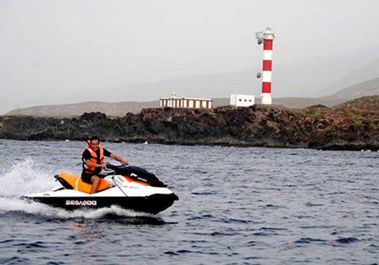 Check out light house while jet skiing Tenerife