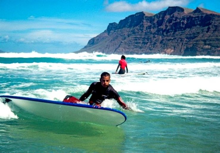 Learning to surf in the waves in Lanzarote