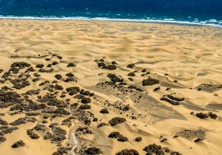 See Maspalomas sand dunes from a helicopter