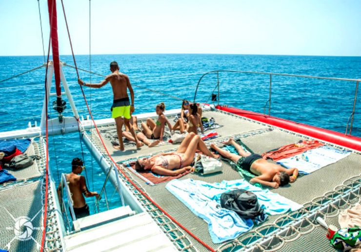 Sunbathing on catamaran Fuerteventura